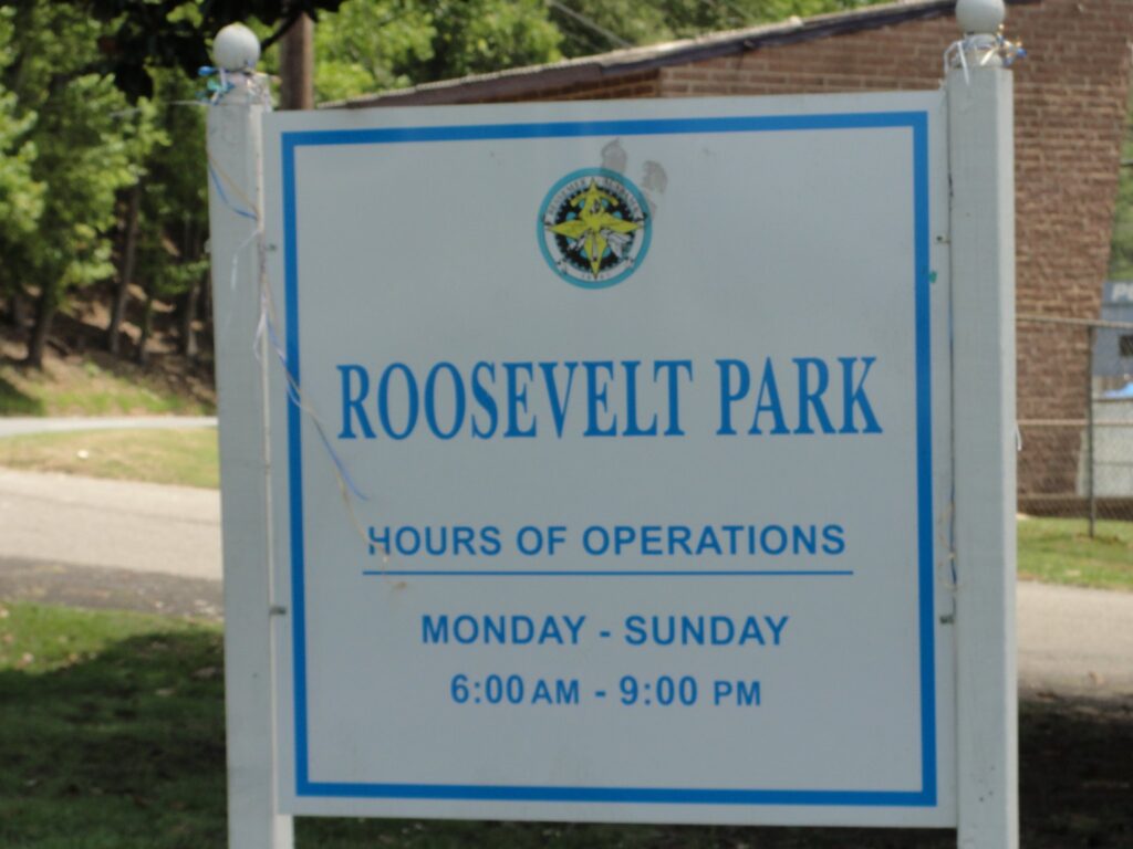 a sign on the side of the street