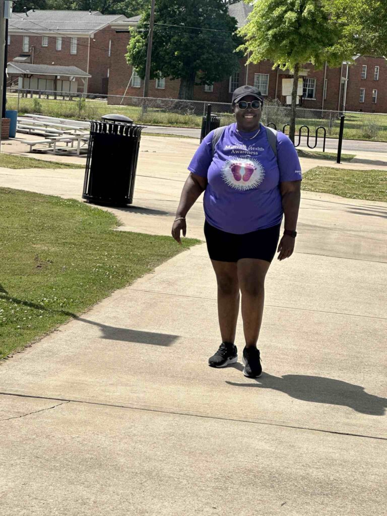 a person standing on a sidewalk