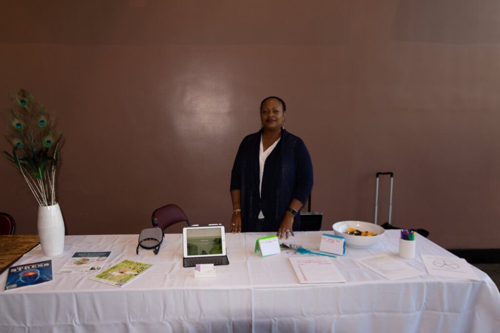 a person sitting at a table with a cake