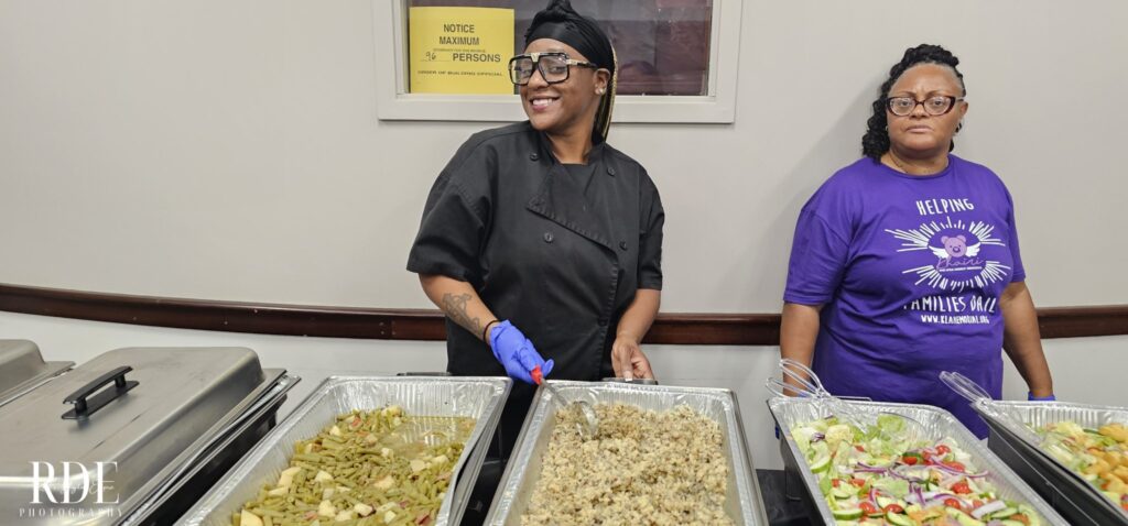 a person standing in front of a tray of food