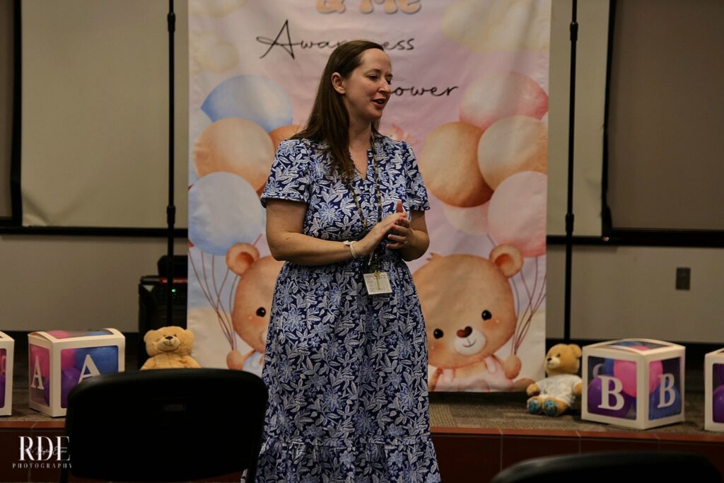 a woman standing in front of a table