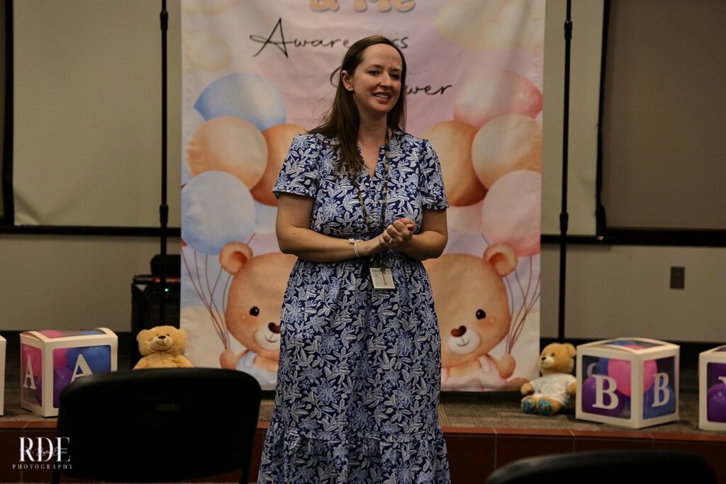 Wendy Kopp standing in front of a cake
