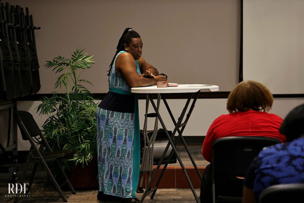 a person standing in front of a laptop
