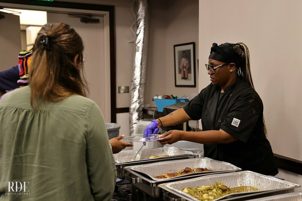 a person standing in a kitchen preparing food
